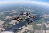 Experienced skydivers in formation while in freefall over Parachute Ottawa