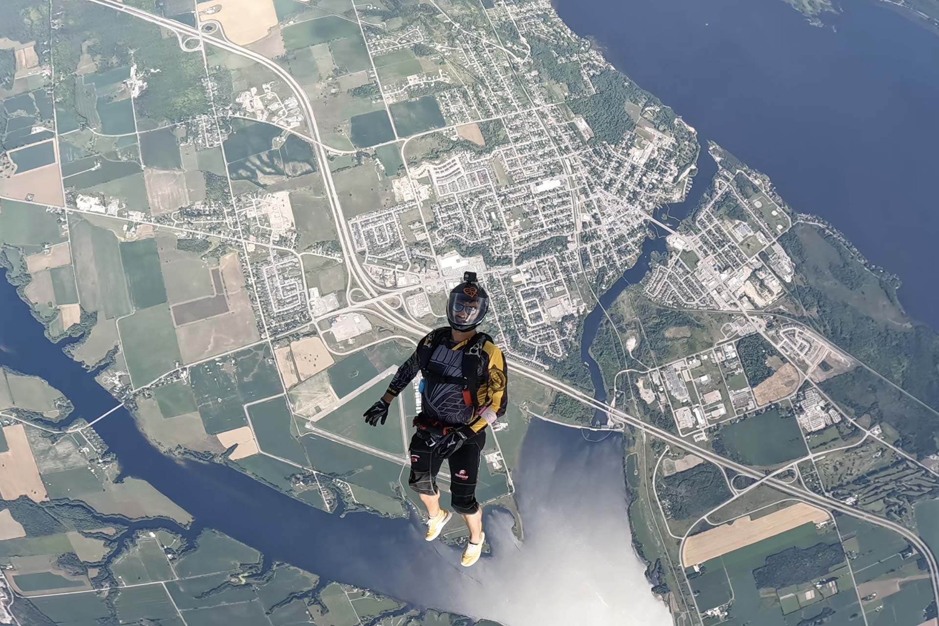 Licensed skydiver in freefall over Parachute Ottawa in Canada