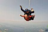 elder man with disability skydiving